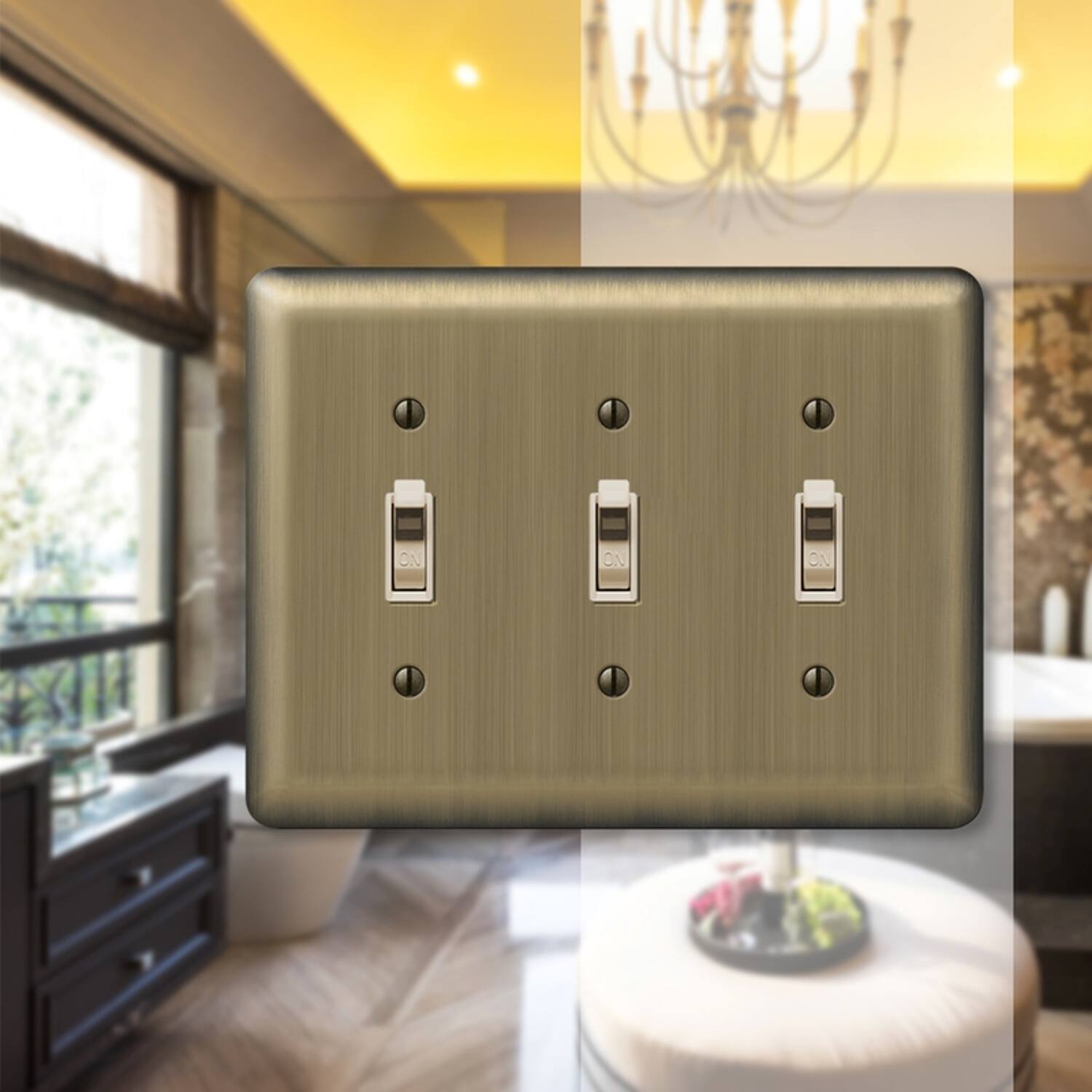 Left. AMERELLE - Amerelle Devon Brushed Brass 3 gang Stamped Steel Toggle Wall Plate 1 pk - Brass.