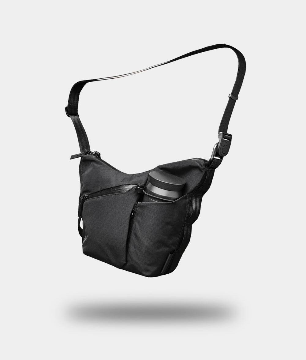 Front. ALPAKA - Flow Satchel Mini 2L Crossbody Bag, Water Resistant Shoulder Bag, Expandable Bottle Pocket, YKK Zippers - Black Axoflux 210D.
