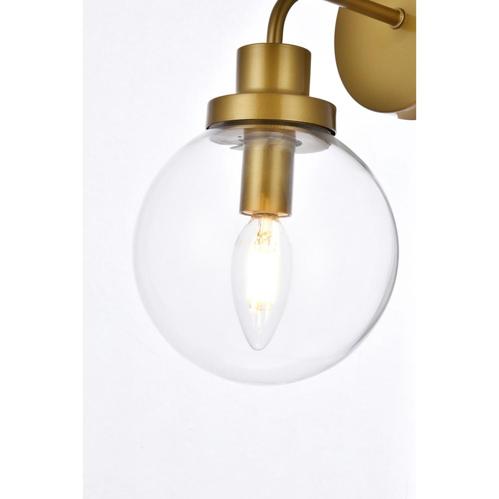 Alt View 1. Living District - Hanson 1 light bath sconce in brass with clear shade - Brass And Clear Shade.
