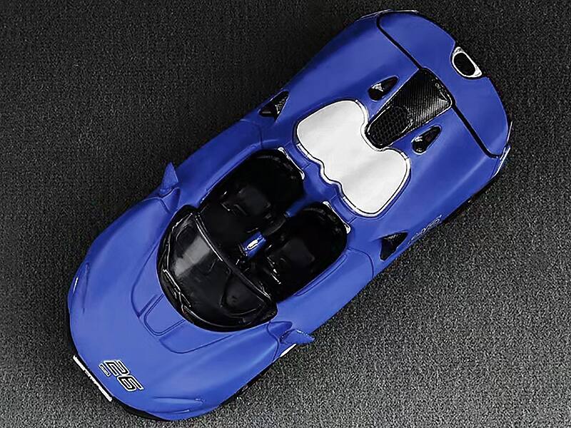 Alt View 3. CM Models - McLaren Elva Convertible #26 Matt Blue with White Stripes and Extra Wheels 1/64 Diecast Model Car by CM Models.