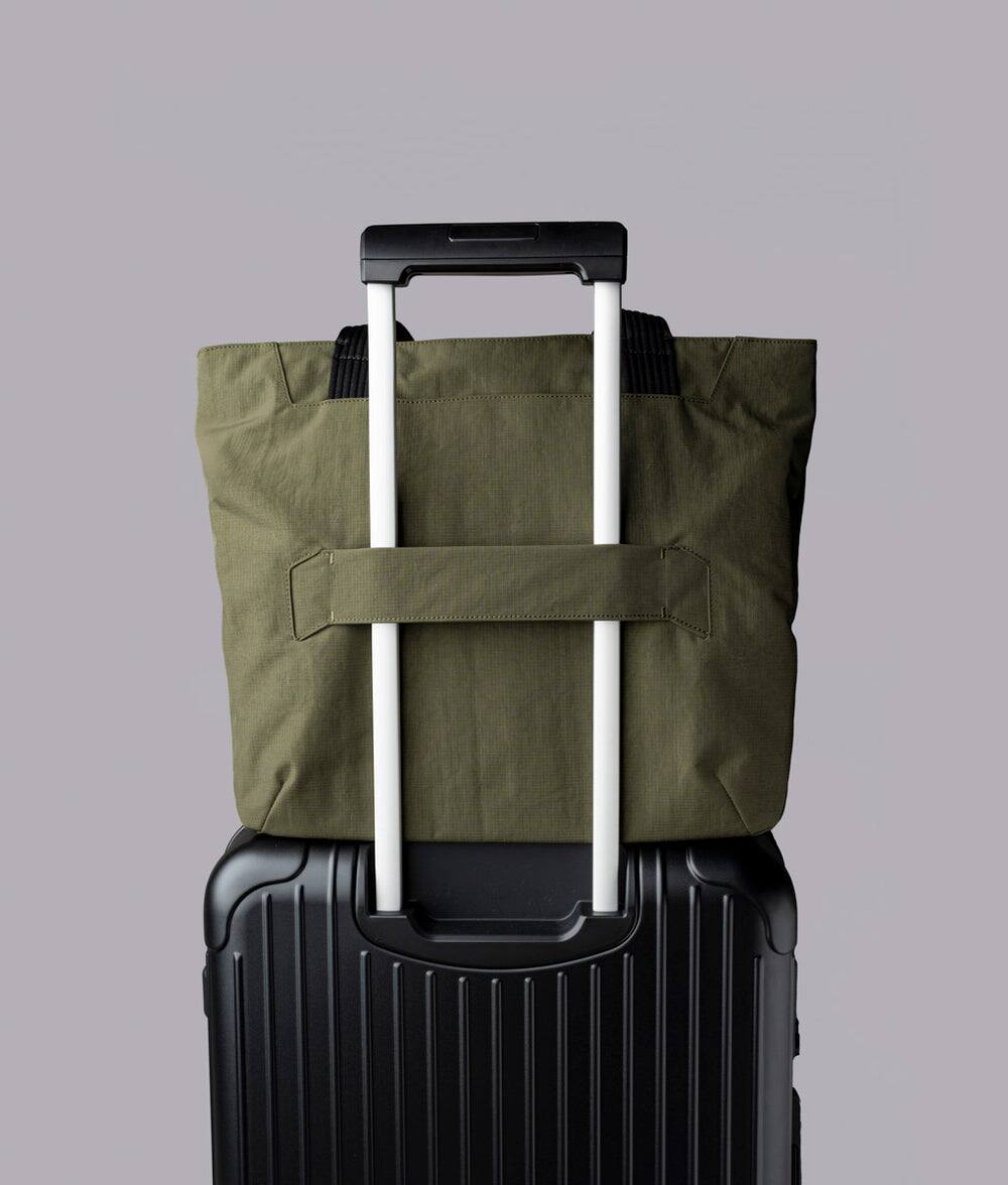 Alt View 6. ALPAKA - Flight Tote (L) Laptop Tote Bag for Work, Large Tote Bag Fits 16" MacBook Pro, Water Bottle Pocket, Luggage Pass-Through - Green Axoflux 400D.