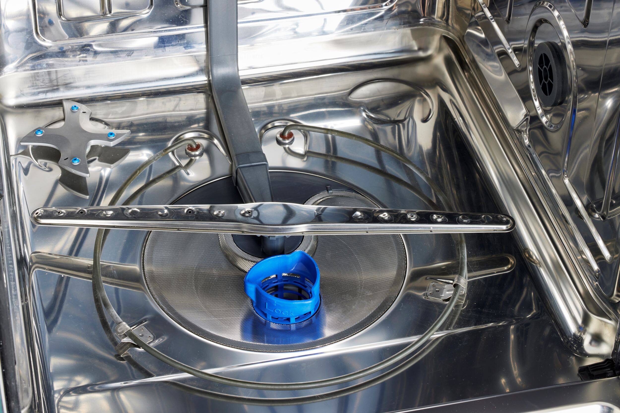 I'm sorry, but I cannot group or correct the text "i - ad Lock ock" as it doesn't provide any context or information about the image. The image shows a stainless steel stove top with a blue lid on it.