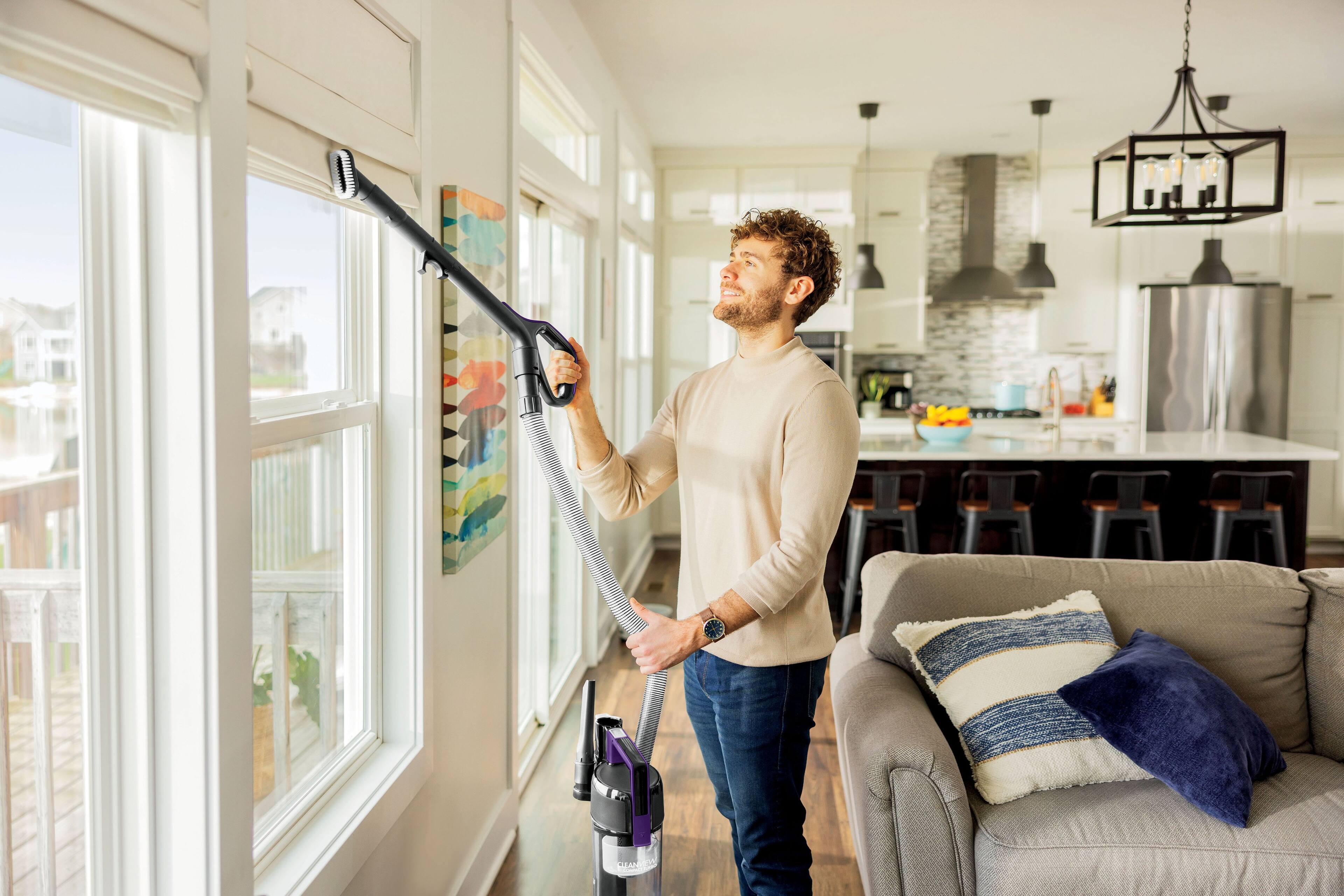 Left. BISSELL - CleanView Compact Turbo Upright Vacuum - Black / Grapevine Purple.