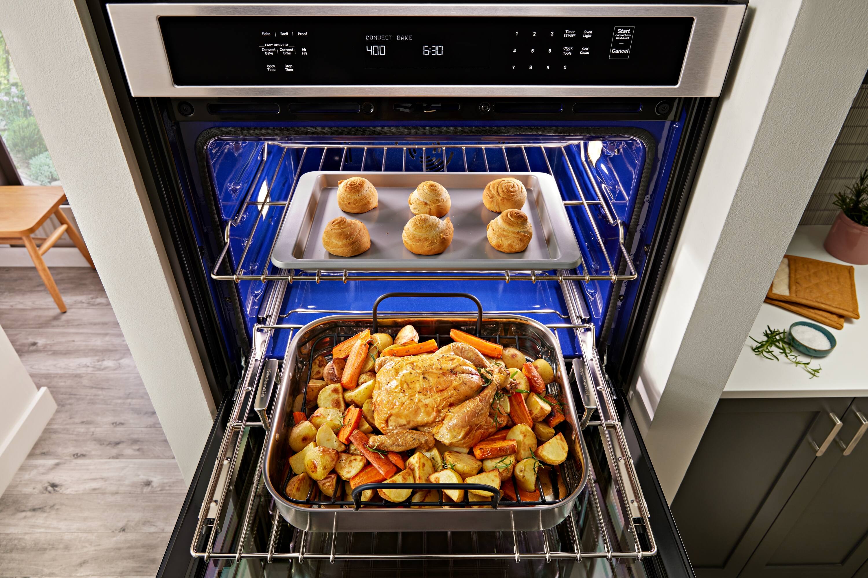 The text on the image is:

- "CONVECT BAKE"
- "6:30"
- "Start"
- "Cancel"
- "Timer"
- "1 2 3 4 5 6 7 8 9 0"

The oven is set to convection bake at 400°F for 6:30 minutes.