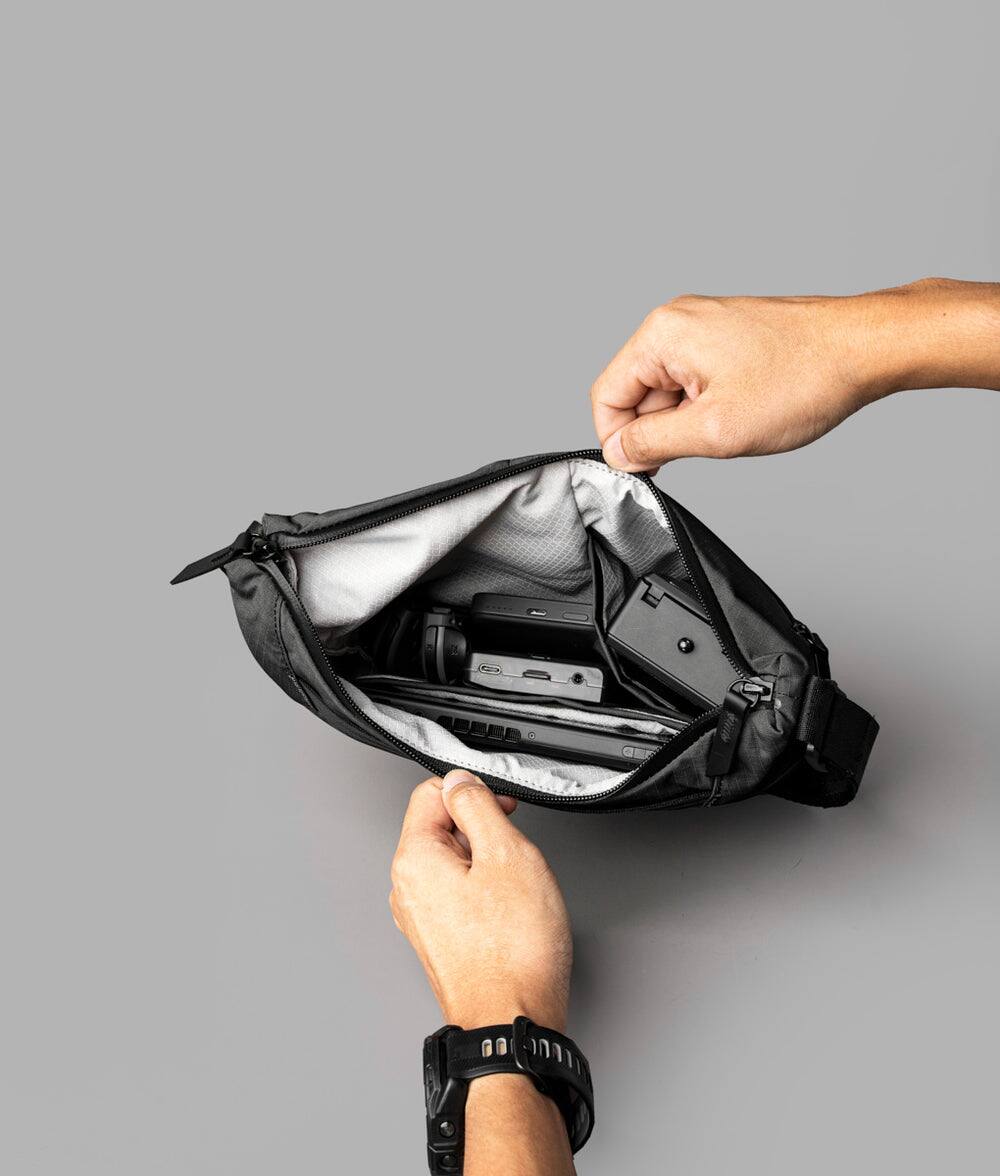 Alt View 5. ALPAKA - Flow Satchel Mini 2L Crossbody Bag, Water Resistant Shoulder Bag, Expandable Bottle Pocket, YKK Zippers - Black Axoflux 210D.