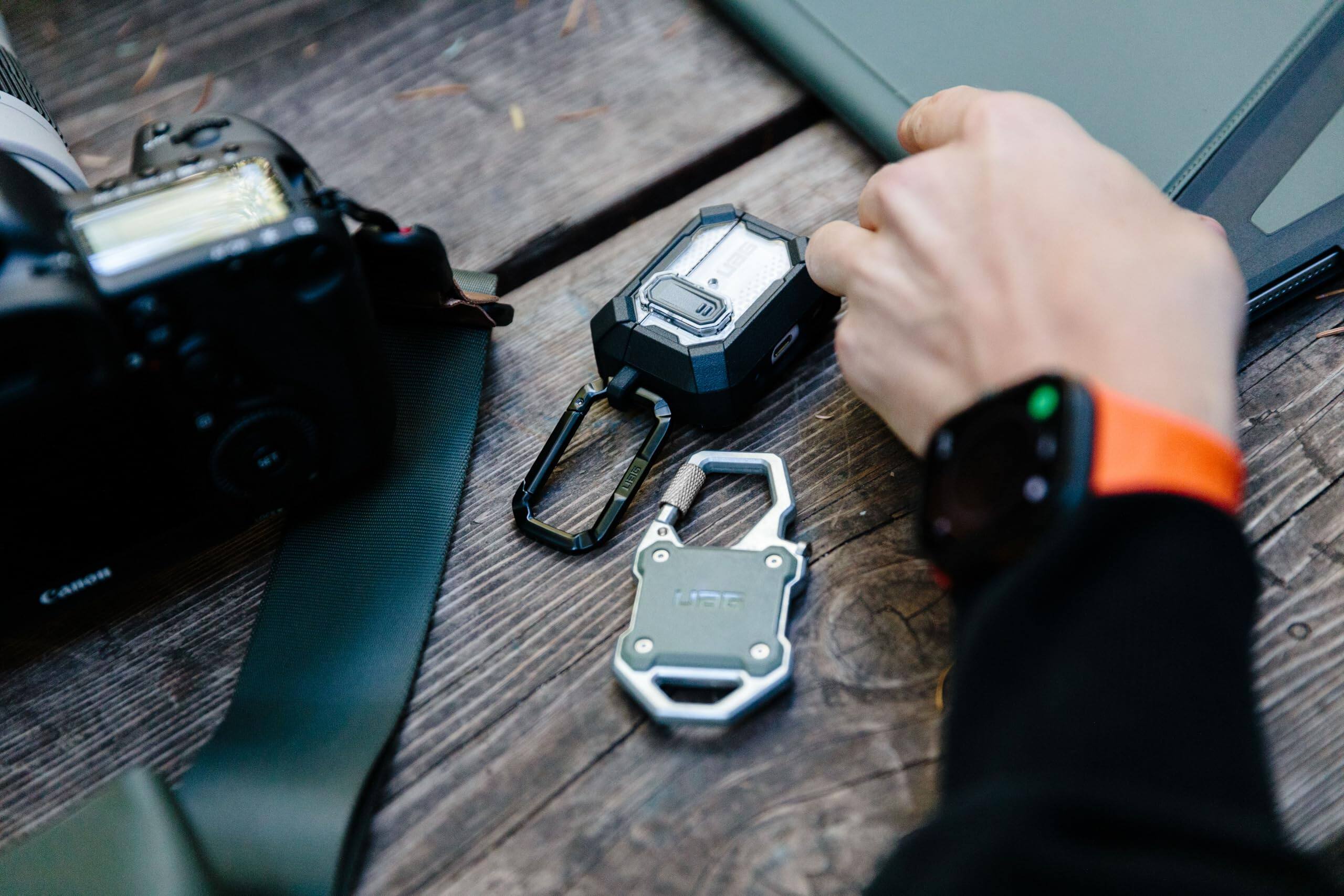 Alt View 2. UAG - AirTag Case w Built-in Bottle Opener & Carabiner for Keys, Luggage & Bags - Olive Drab/Silver.