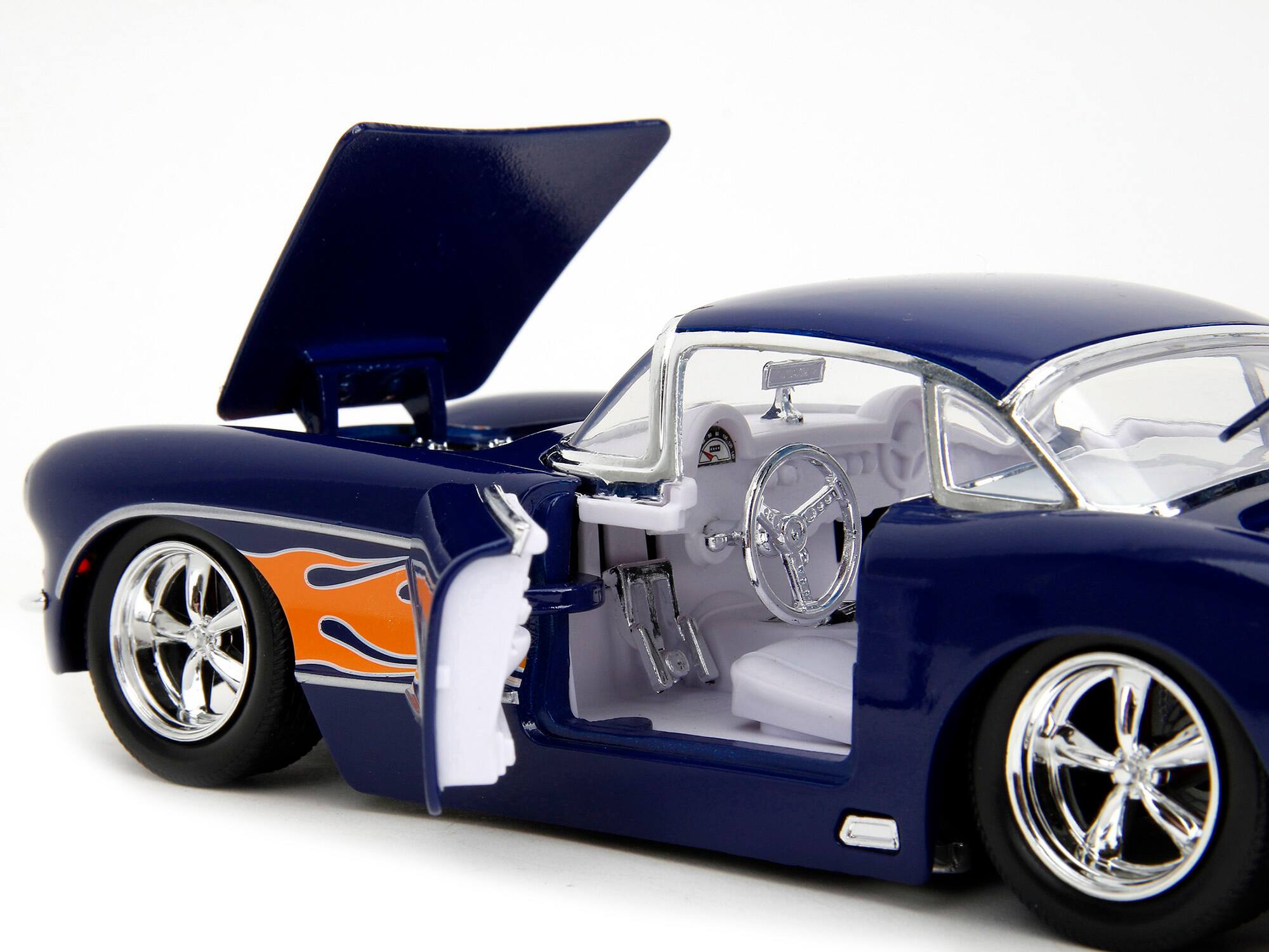 Left. Jada - 1957 Chevrolet Corvette Dark Blue with Flame Graphics and White Interior "Bigtime Muscle" Series 1/24 -  Dark Blue with White.