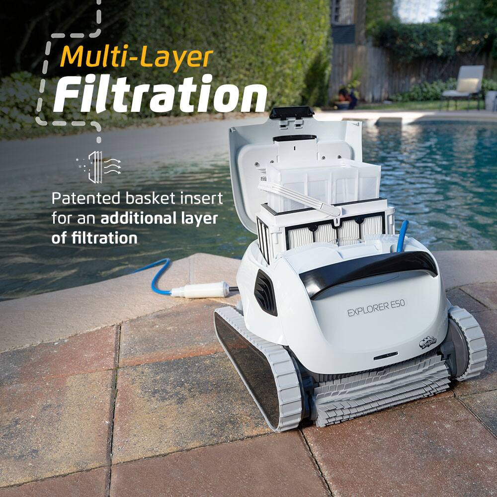 The image features a white machine with a patented basket insert for an additional layer of filtration. The machine is designed for multi-layer filtration, providing a more efficient and effective way to clean water. The machine is placed on a brick surface, possibly a patio, and is ready for use.