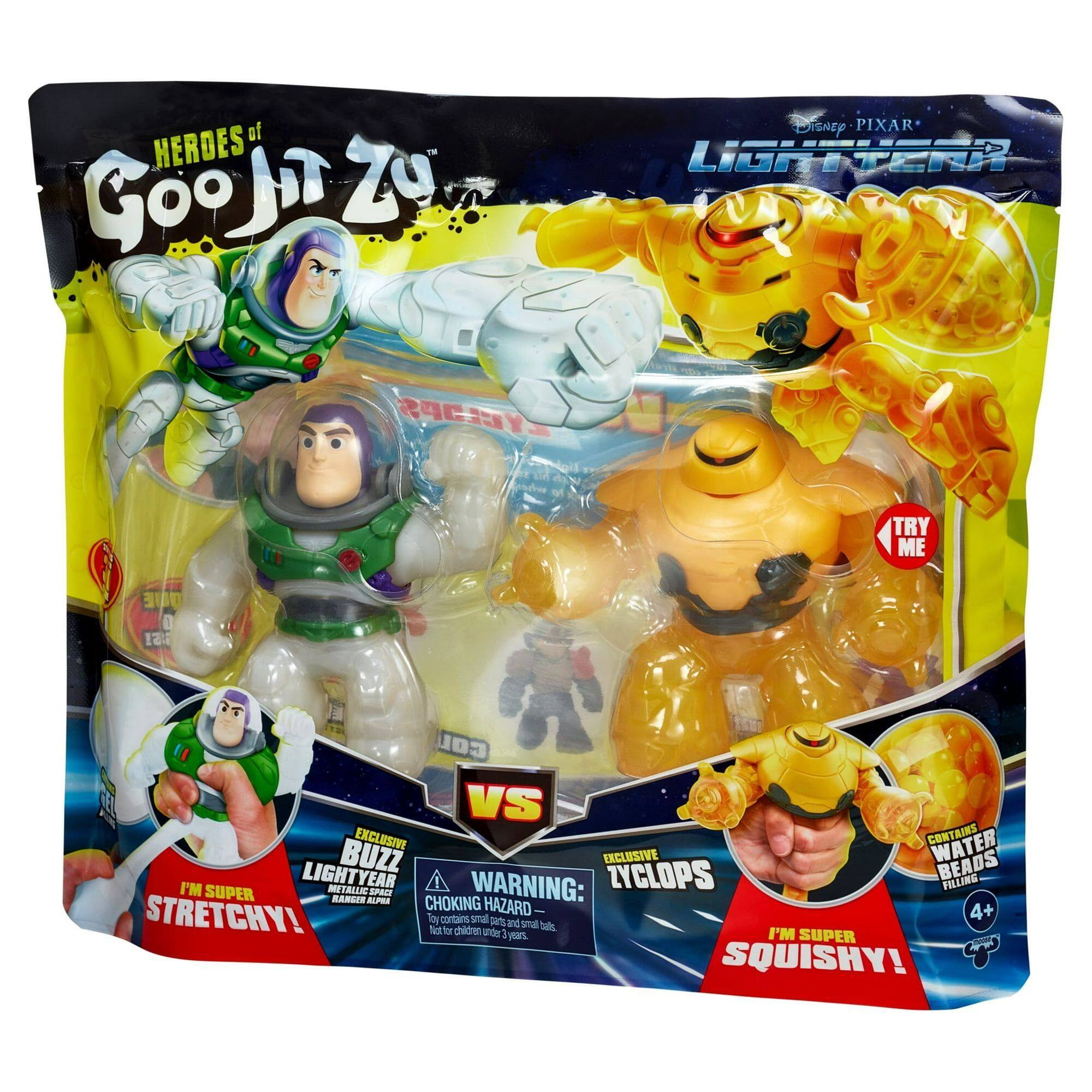 The text on the image can be grouped and corrected as follows:

**Product Name:**
- "HEROES of Goojitzu"

**Characters:**
- "LIGHTYEAR"
- "BUZZ"

**Features:**
- "EXCLUSIVE"
- "CONTAINS WATER BUZZ EXCLUSIVE BEADS"
- "I'M LIGHTYEAR TALIIC"
- "I'M SUPER SQUISHY!"

**Warnings:**
- "WARNING: ZYCLOPS FILLING SUPER SPACE"
- "CHOKING HAZARD: 4+ lby contans sa S and small parts for children under 3 years"

**Additional Text:**
- "TRY ME"
- "VS"
- "I'M SUPER STRETCHY!"