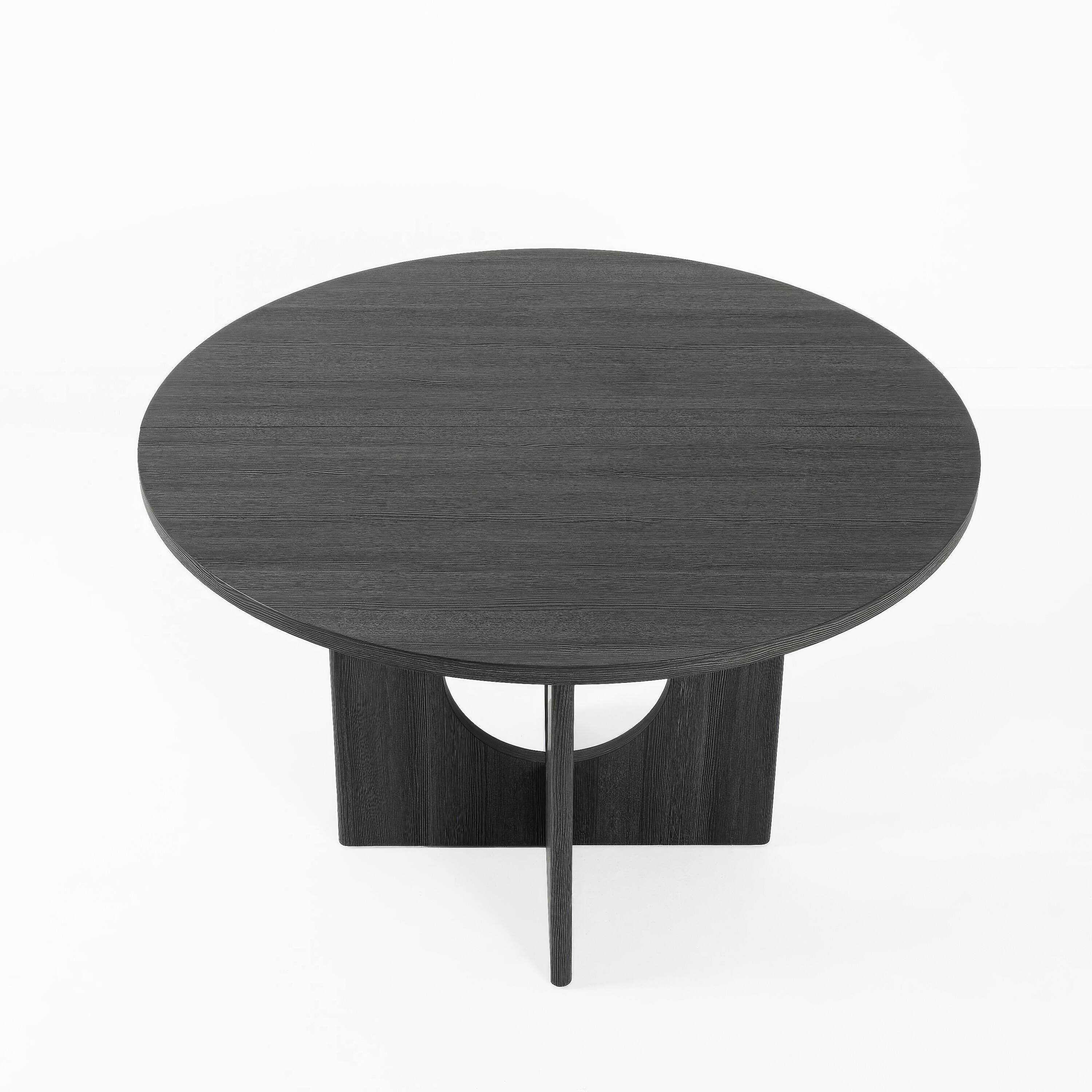 Angle. Manhattan Lane - Kysa Dining Table, 47 Inch Round Top, Cross U Pedestal Base - Dark Gray.
