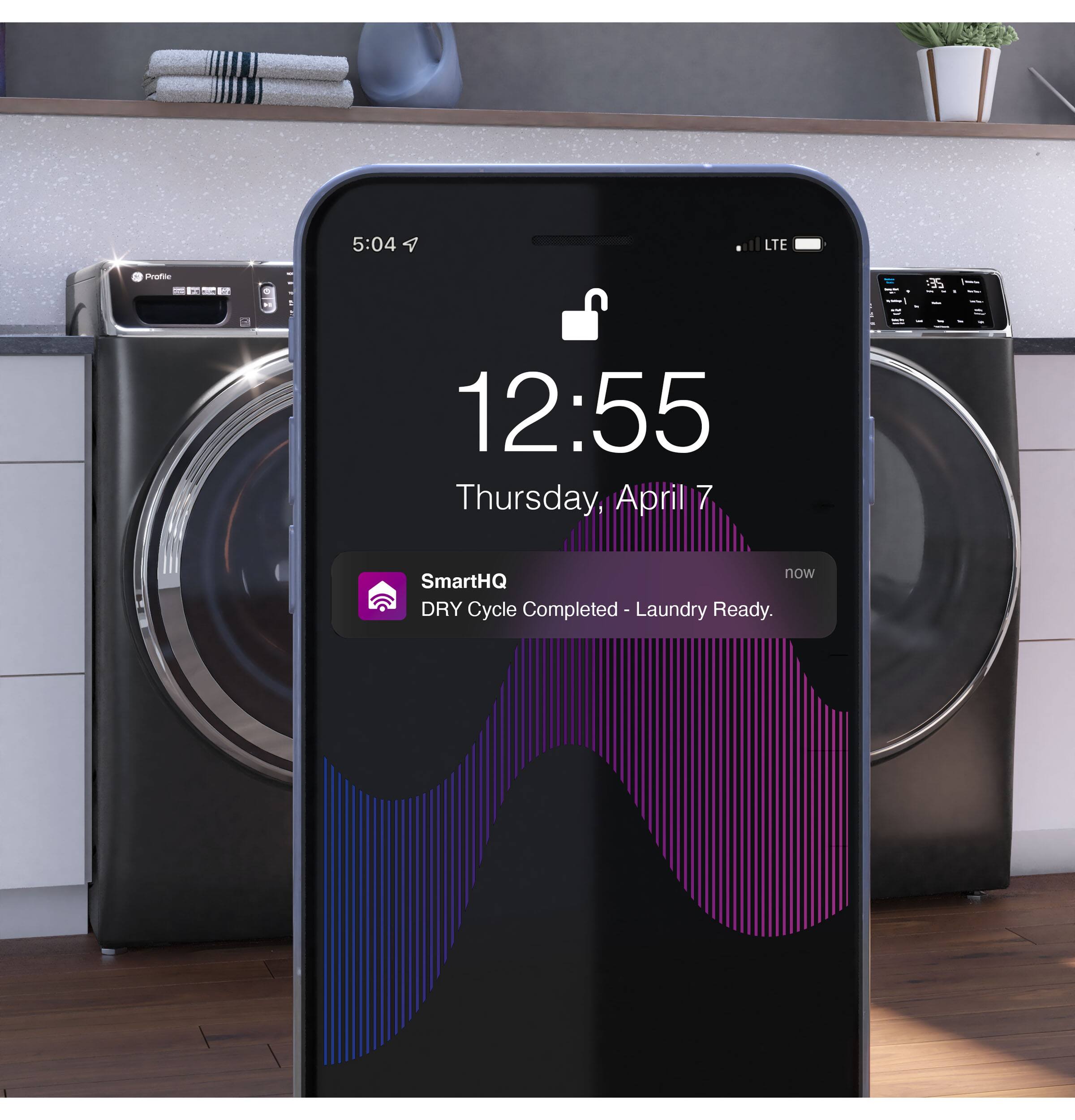 The text on the image reads: "5:04 LTE Preatoe - I - - 12:55 Thursday, April 7 now SmartHQ DRY Cycle Completed oe Laundry Ready."