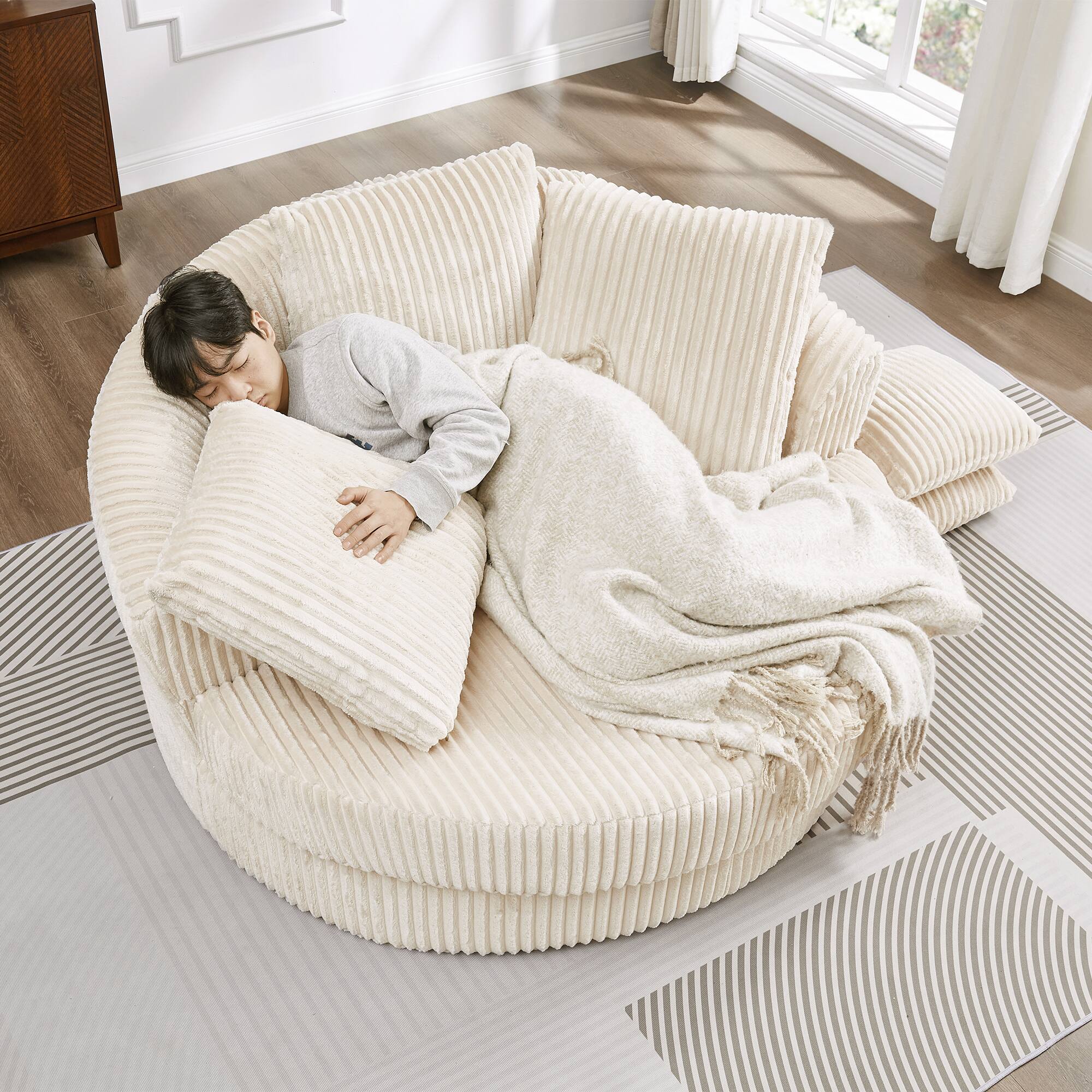 Left. Trinkets Crazed - 61-Inch Oversized Round Chaise Longue Chair Indoor, Modern Upholstered Corduroy Deep Seat Chair - Beige.