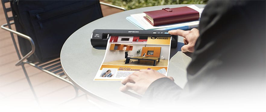 Portable scanner on outdoor patio table