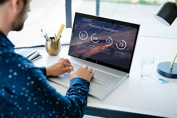 Man with HP laptop in home office