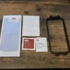 ZAGG InvisibleShield Glass XTR4 kit contents including dust sticker, wipes, and installation tray, click to load a larger version