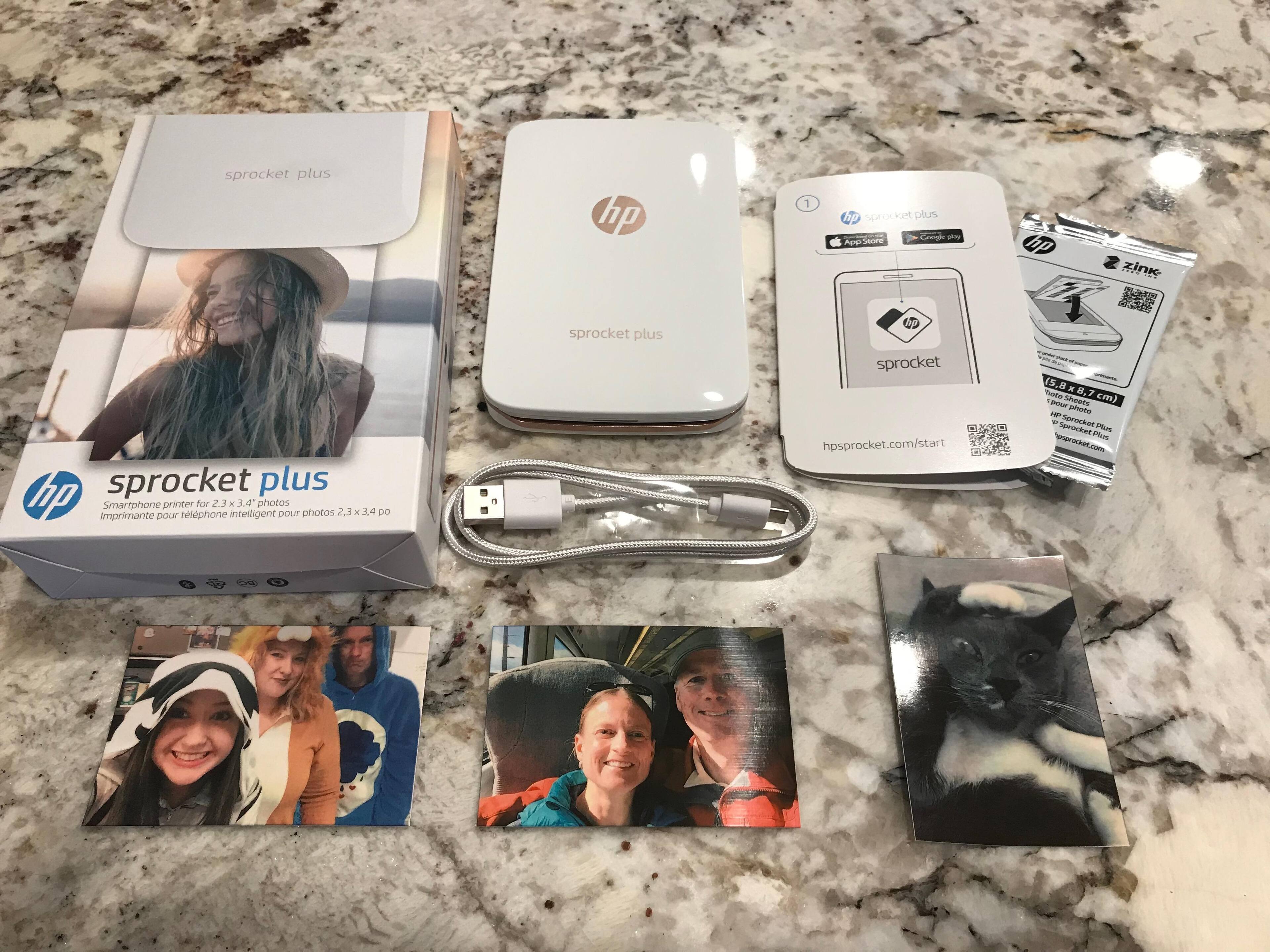 Everything in the box (the cable is especially nice) and some sample pictures., click to load a larger version