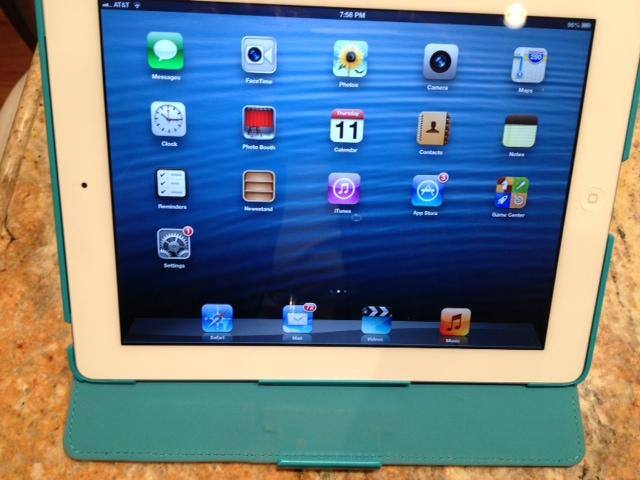 Working on the iPad with my "branding" color cover while able to use Keynote, play music, check contact info and run credit cards all on one device., click to load a larger version