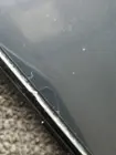 Dust under adhesive border and chip/crack in glass, click to load a larger version