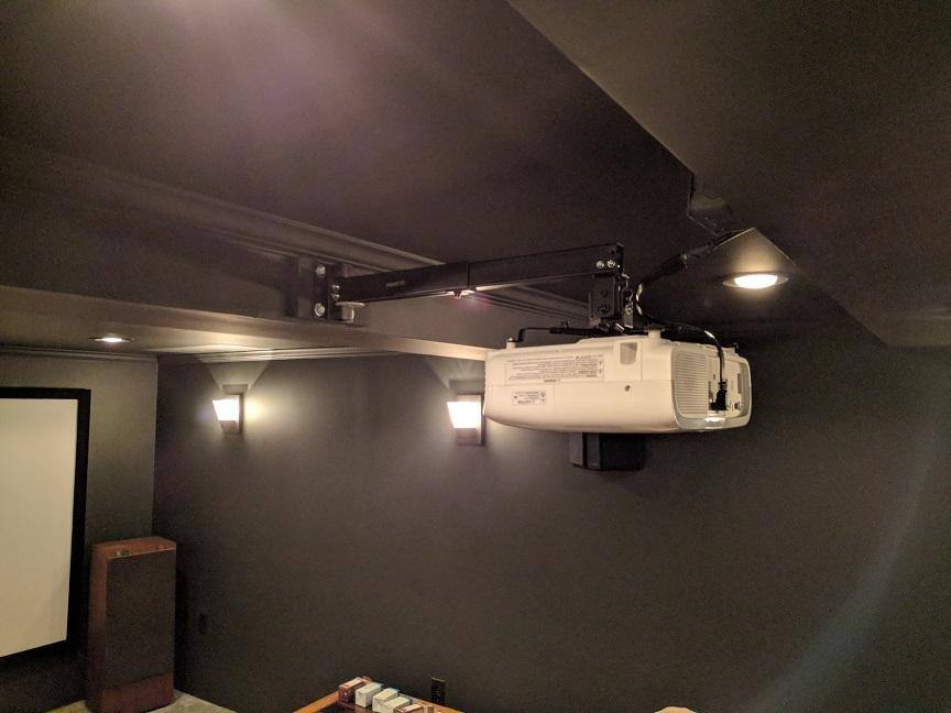 mounted the projector to the main support beam for my house to prevent it shaking from bass, click to load a larger version