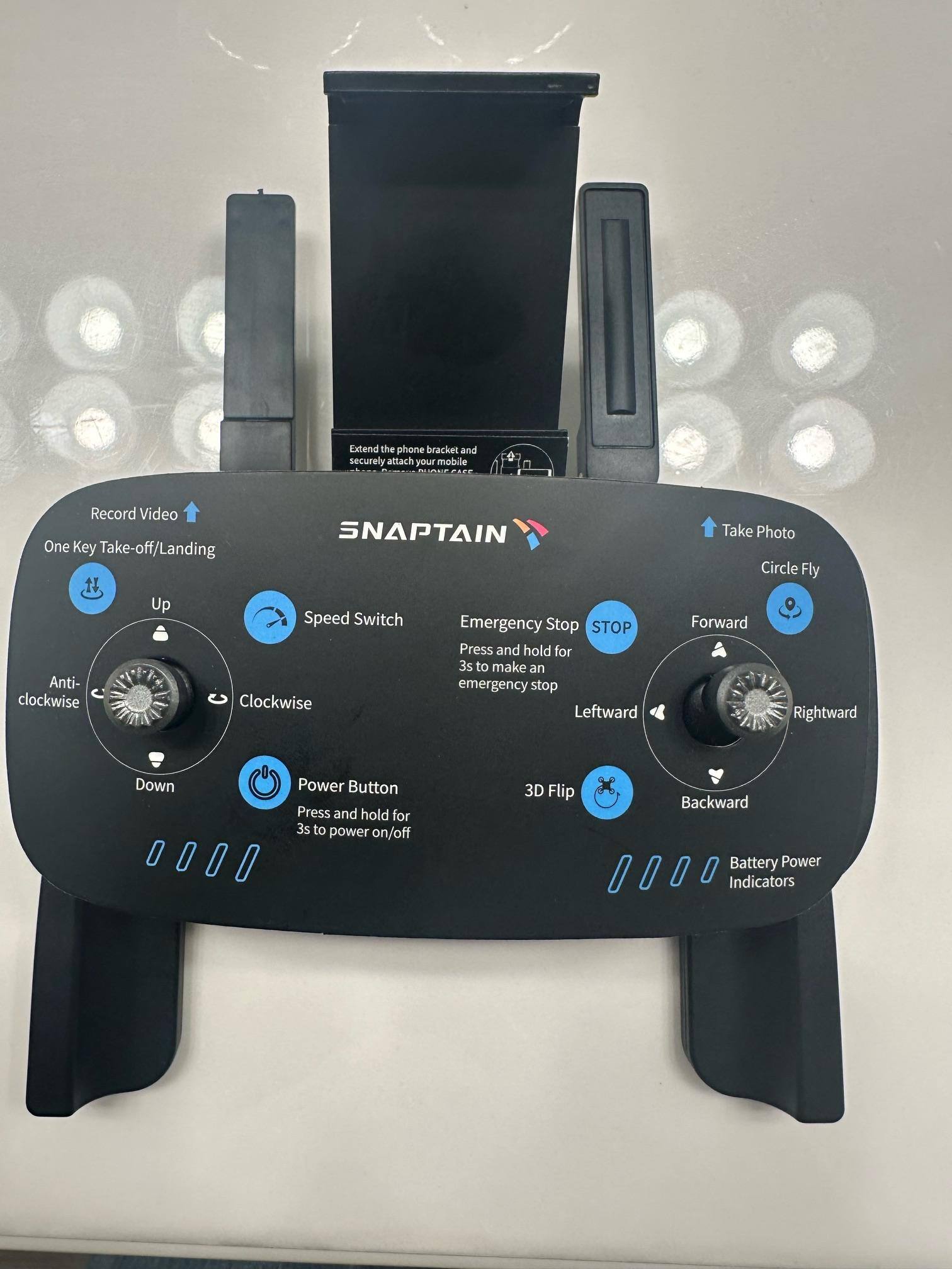 Remote, layover instructions and phone holder, click to load a larger version