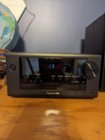 Front of control console, cd tray open button on bottom left side, as well as headphone jack., click to load a larger version