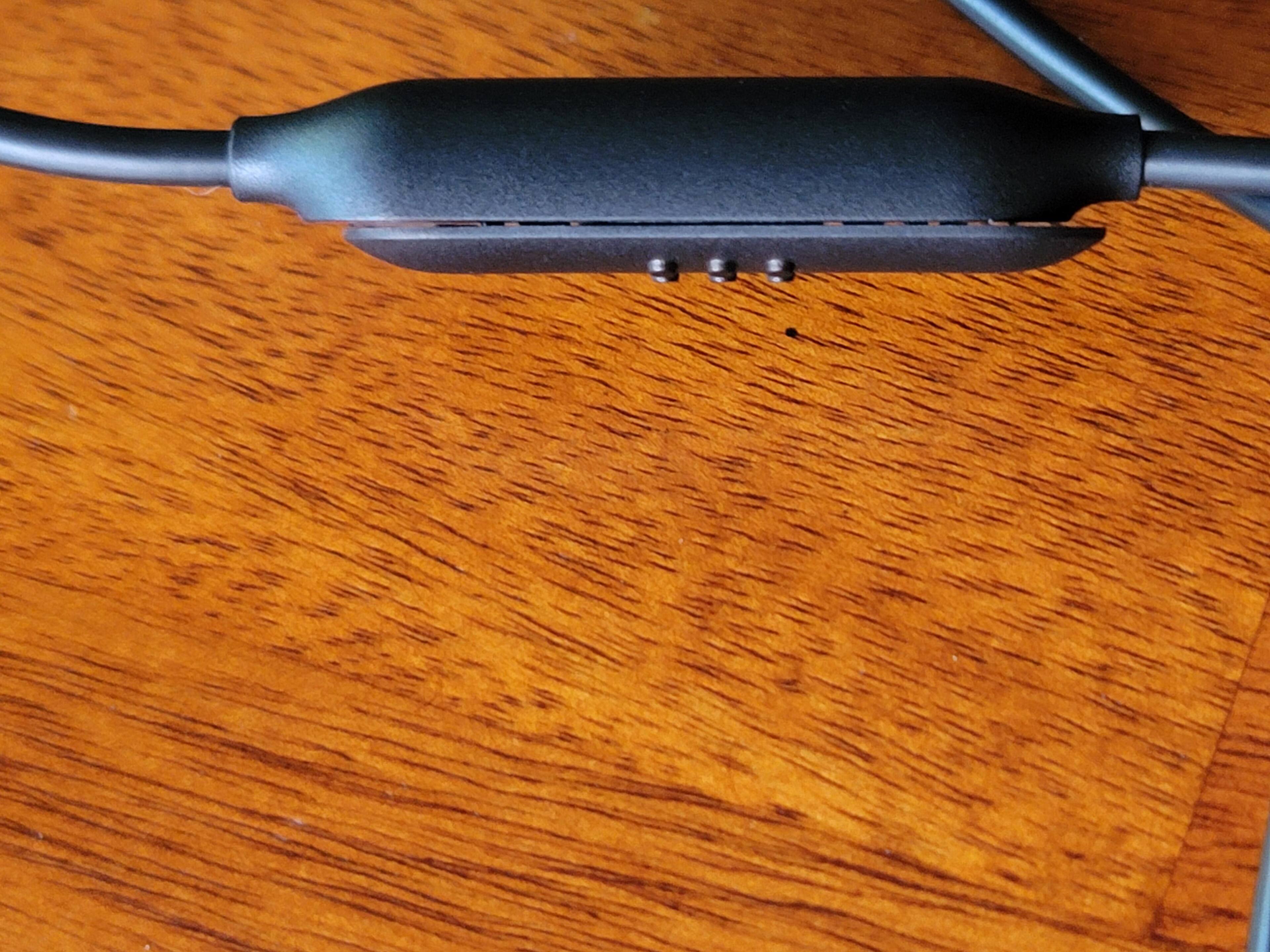 The inline microphone toggle switch for the mic module. You can see the air gaps between the switch, and it feels loose/cheaply made in hand., click to load a larger version