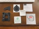 Alignment tray and stiff plastic card in addition to two sets of the screen protector and cleaning pack., click to load a larger version