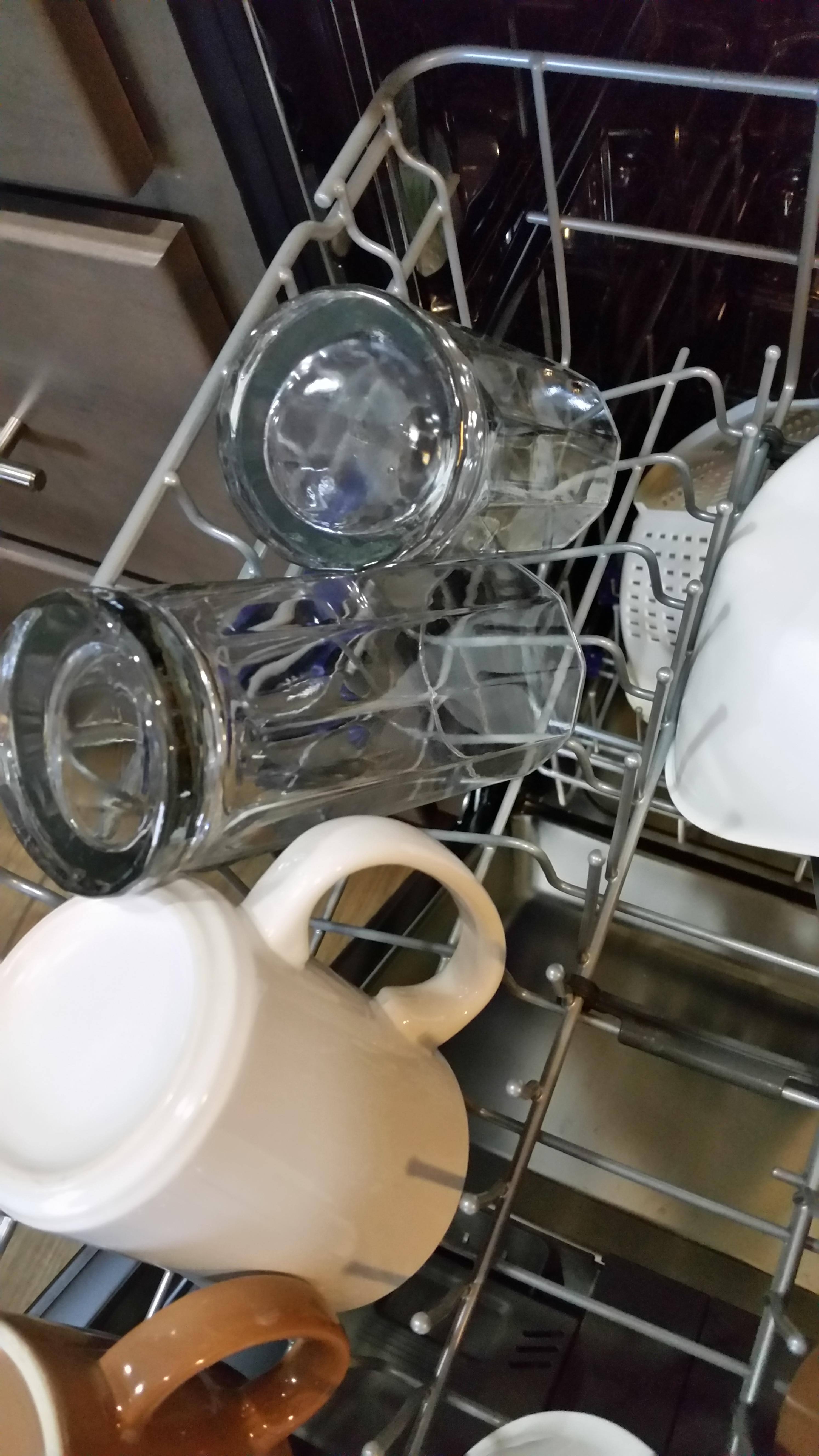 Banged against top rack when I pushed in and glasses fell over., click to load a larger version