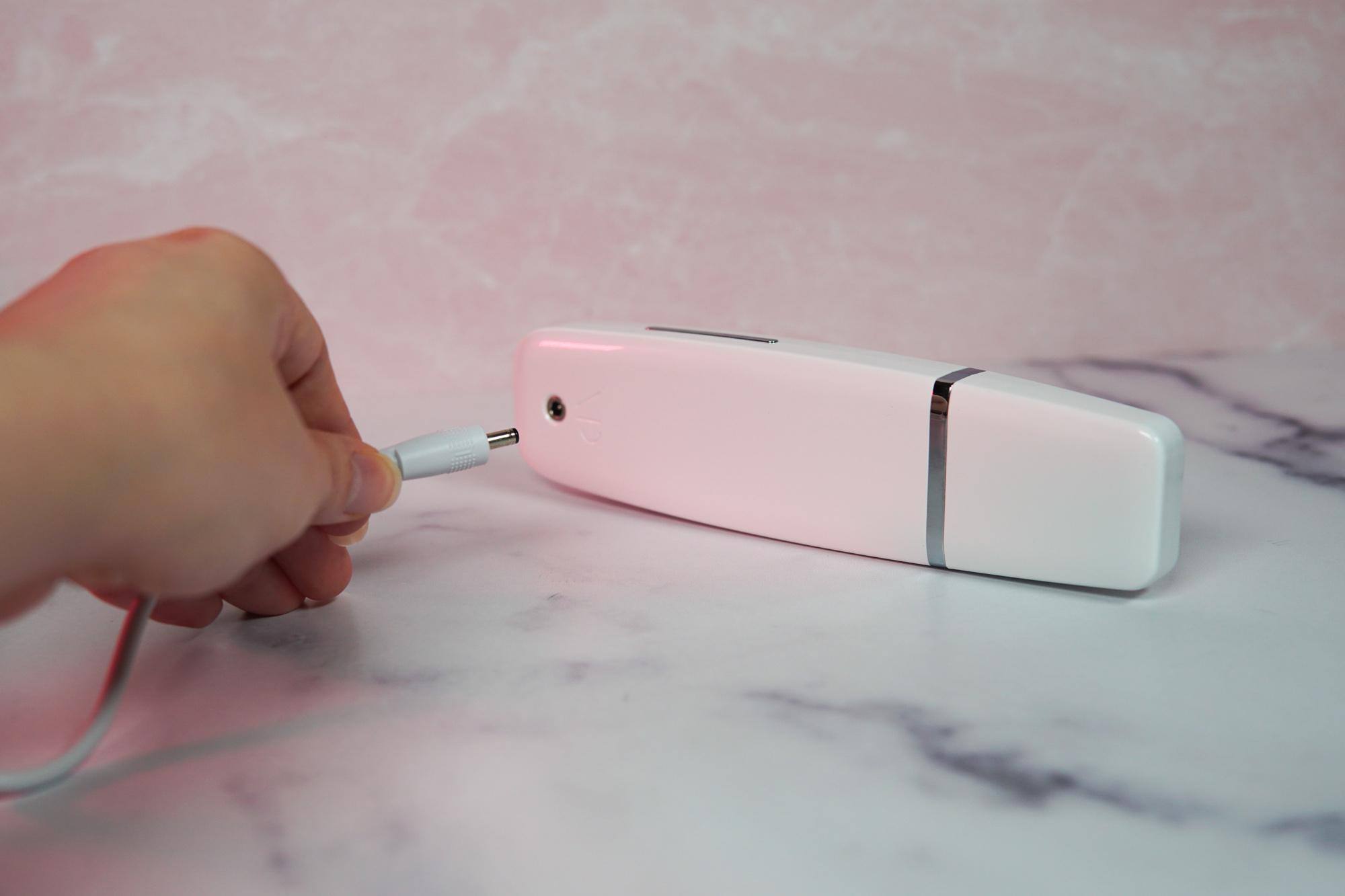 Wand comes with a white power adapter that plugs into the back of the unit., click to load a larger version