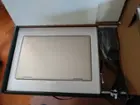 Laptop and power adapter in box, click to load a larger version