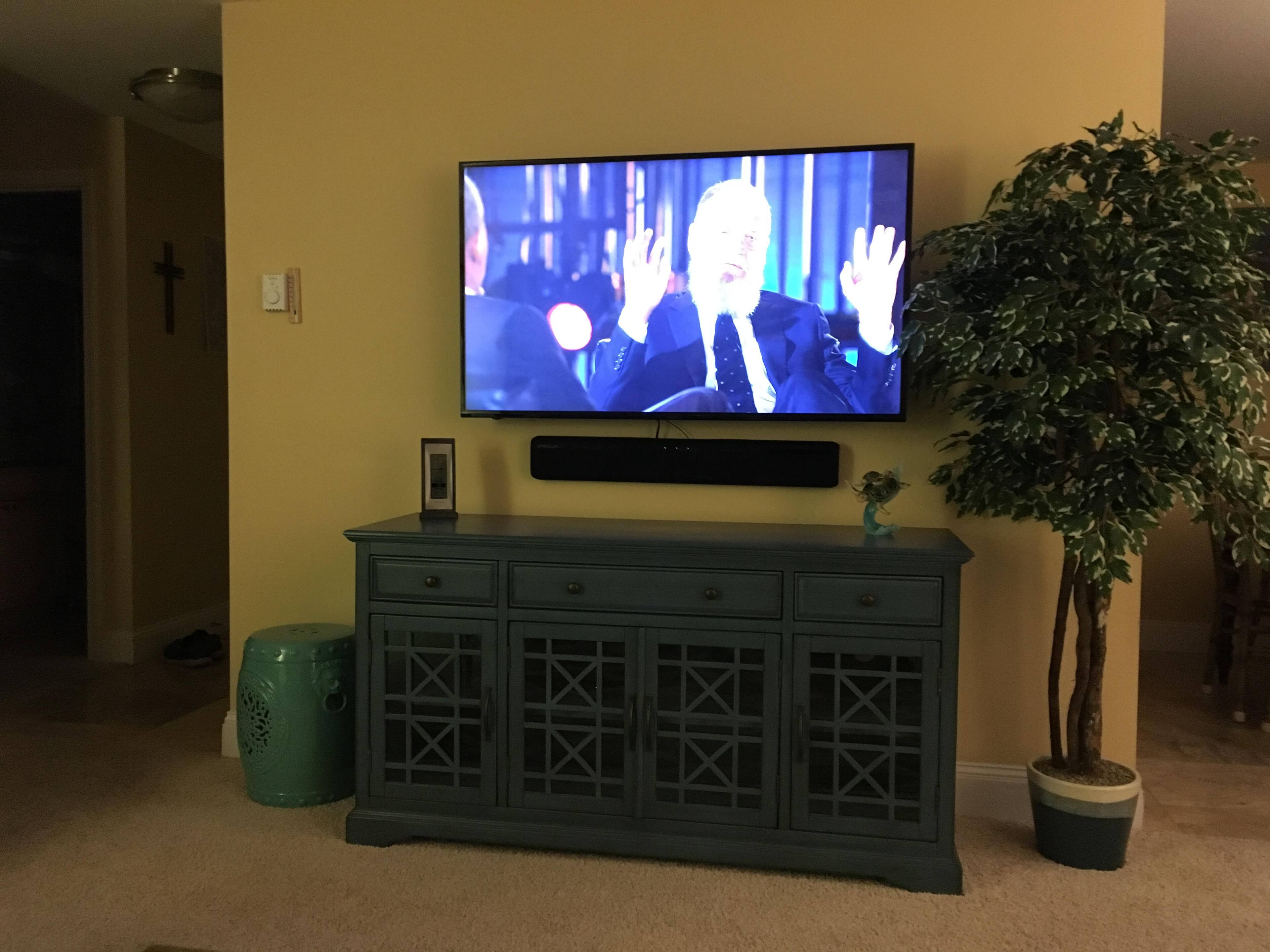 Wall mounted 55” Insignia TV, click to load a larger version