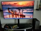 Computer set up next to 55 inch TV, click to load a larger version