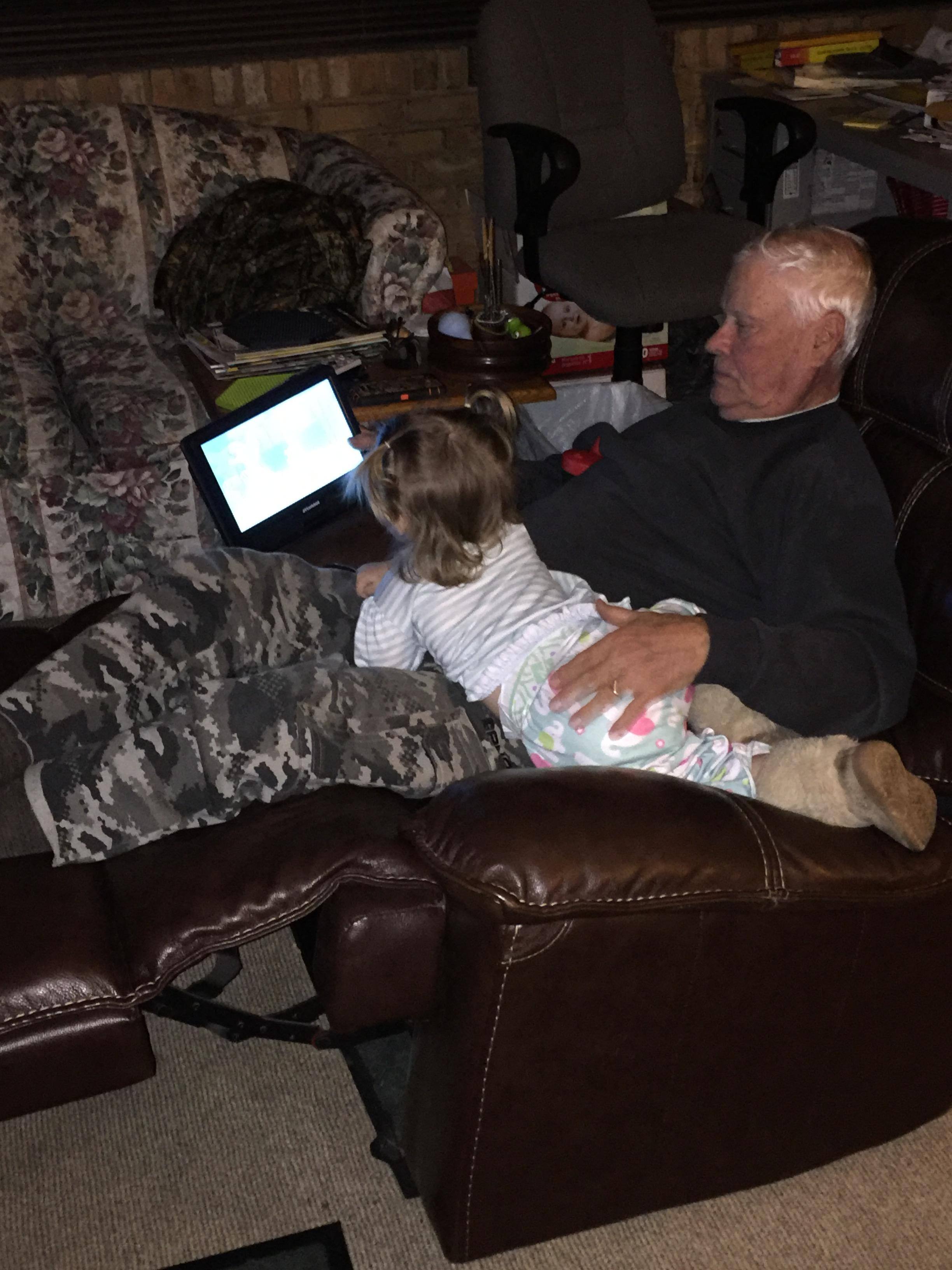 She loves her pappie and her DVD player, click to load a larger version
