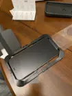 Placing the iPhone into the slot case. This was loose for me and had a hard time centering it, click to load a larger version