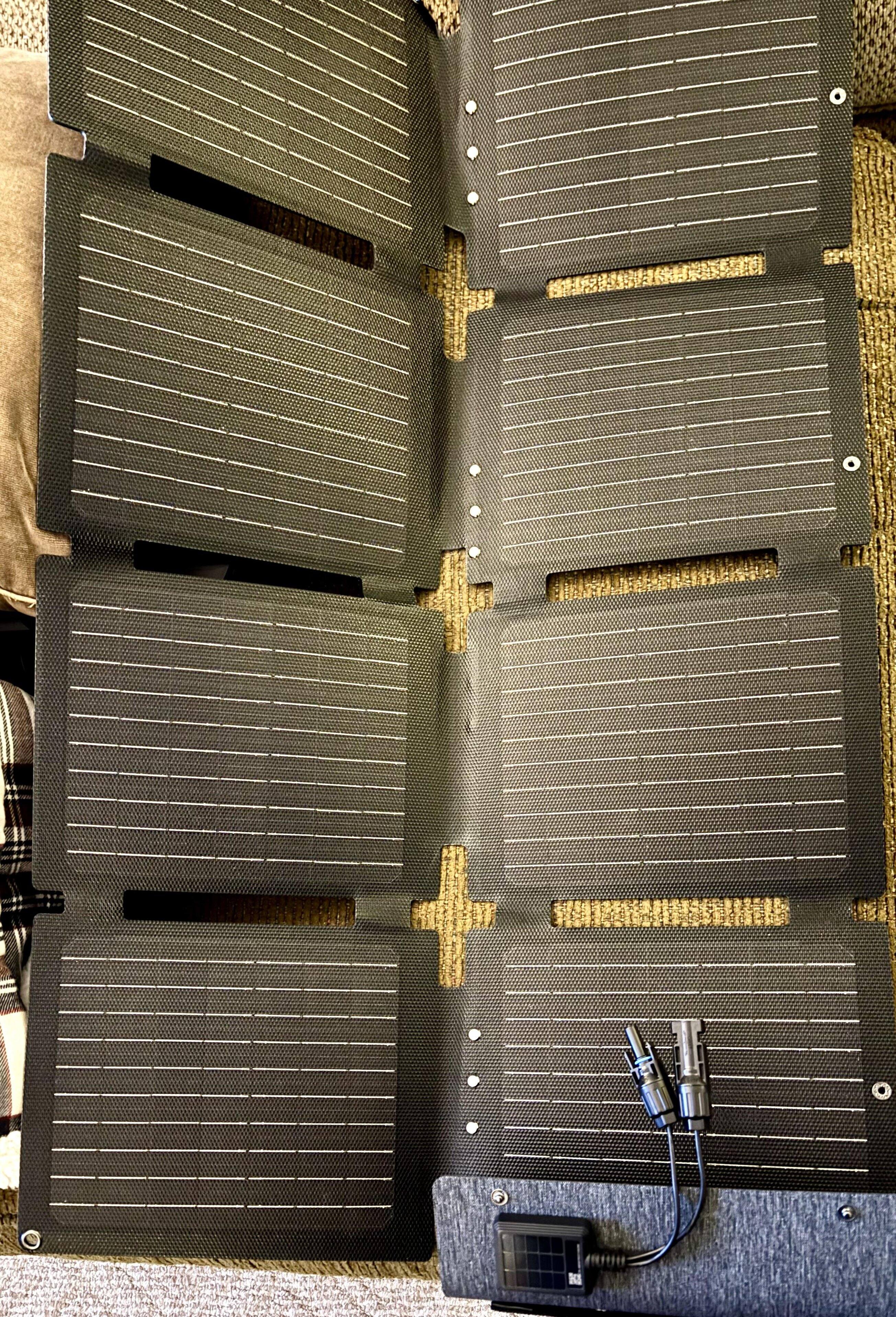 The solar panel that comes with the appropriate kit folds up into a neat square for storage.  Plugs into the front of the Solix for charging. Just note it will take a number of hours in strong, direct, sunlight for a full charge. Free power!, click to load a larger version