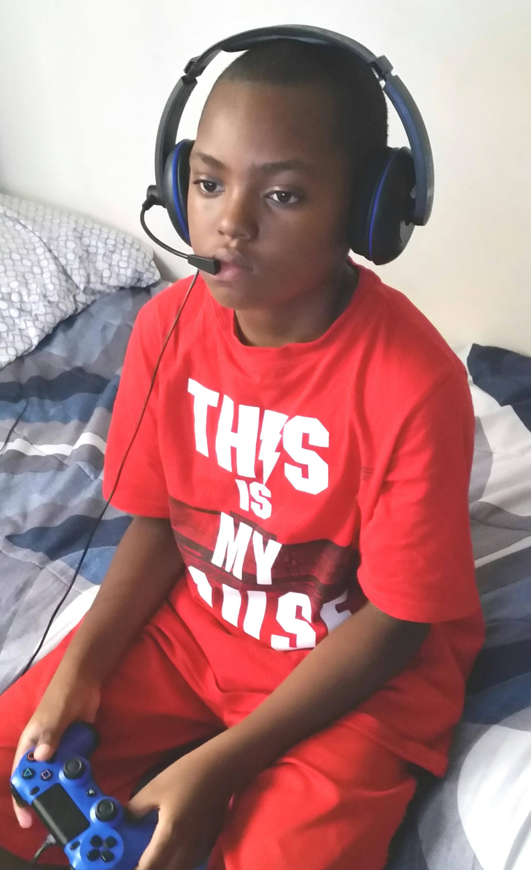 My 10 year old, the headset & his PS4, click to load a larger version