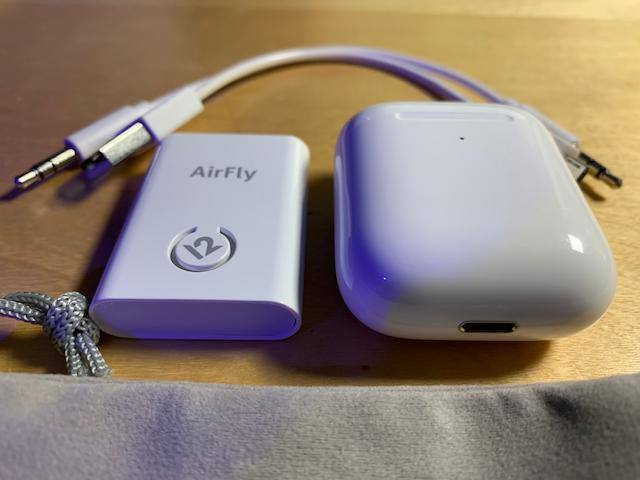 Size Comparison with AirPods, click to load a larger version