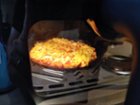 This is the view of a small pizza being made through the window.  It looks better in person and is very easy to see., click to load a larger version