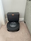 Docked Roomba, with compact but efficient docking station., click to load a larger version