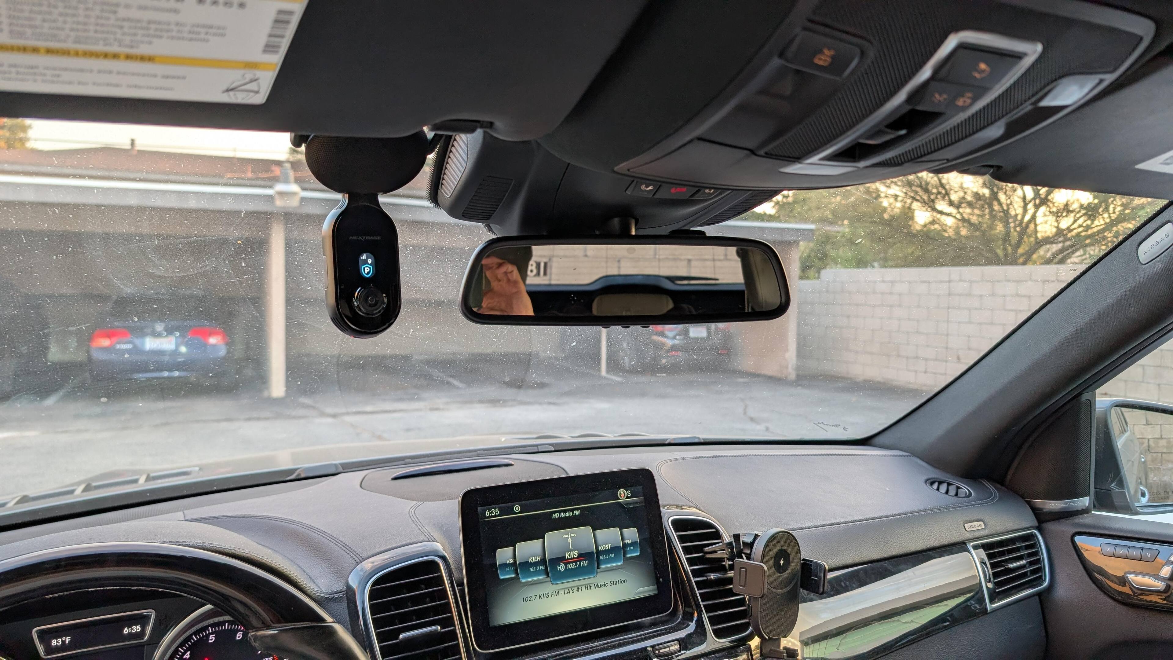 the size is too big to be on my side of the windshield but i have not choice because of that rearview mirror console, click to load a larger version