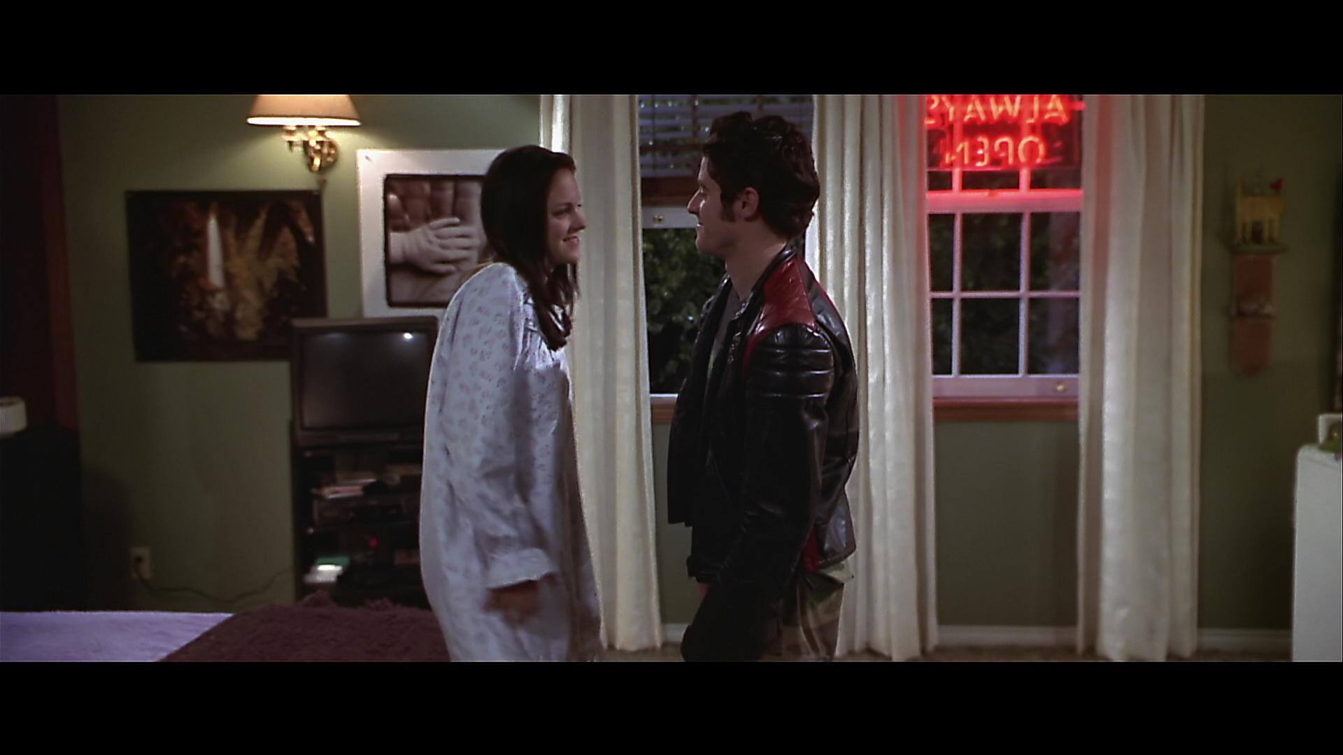 poor detail, smearing, and edge enhancement (see around his jacket, her hair, the curtain, etc), click to load a larger version