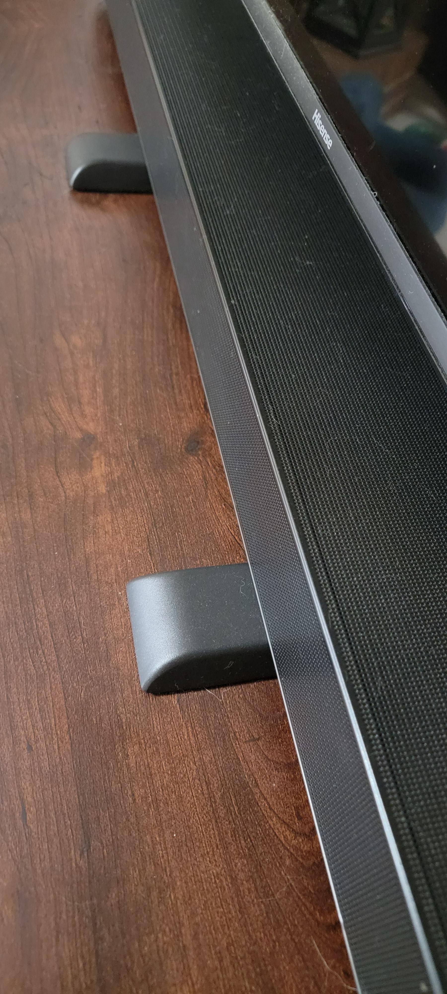 TV feet with soundbar on them., click to load a larger version