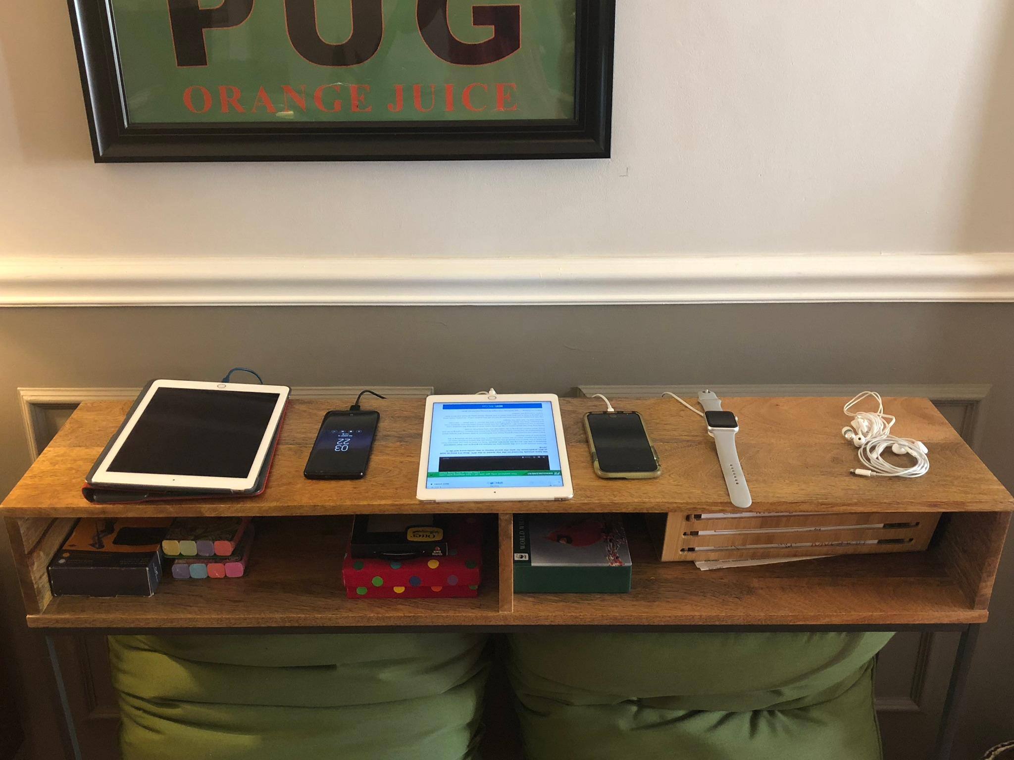 Five gadgets charging simultaneously and in a row. Nice!, click to load a larger version
