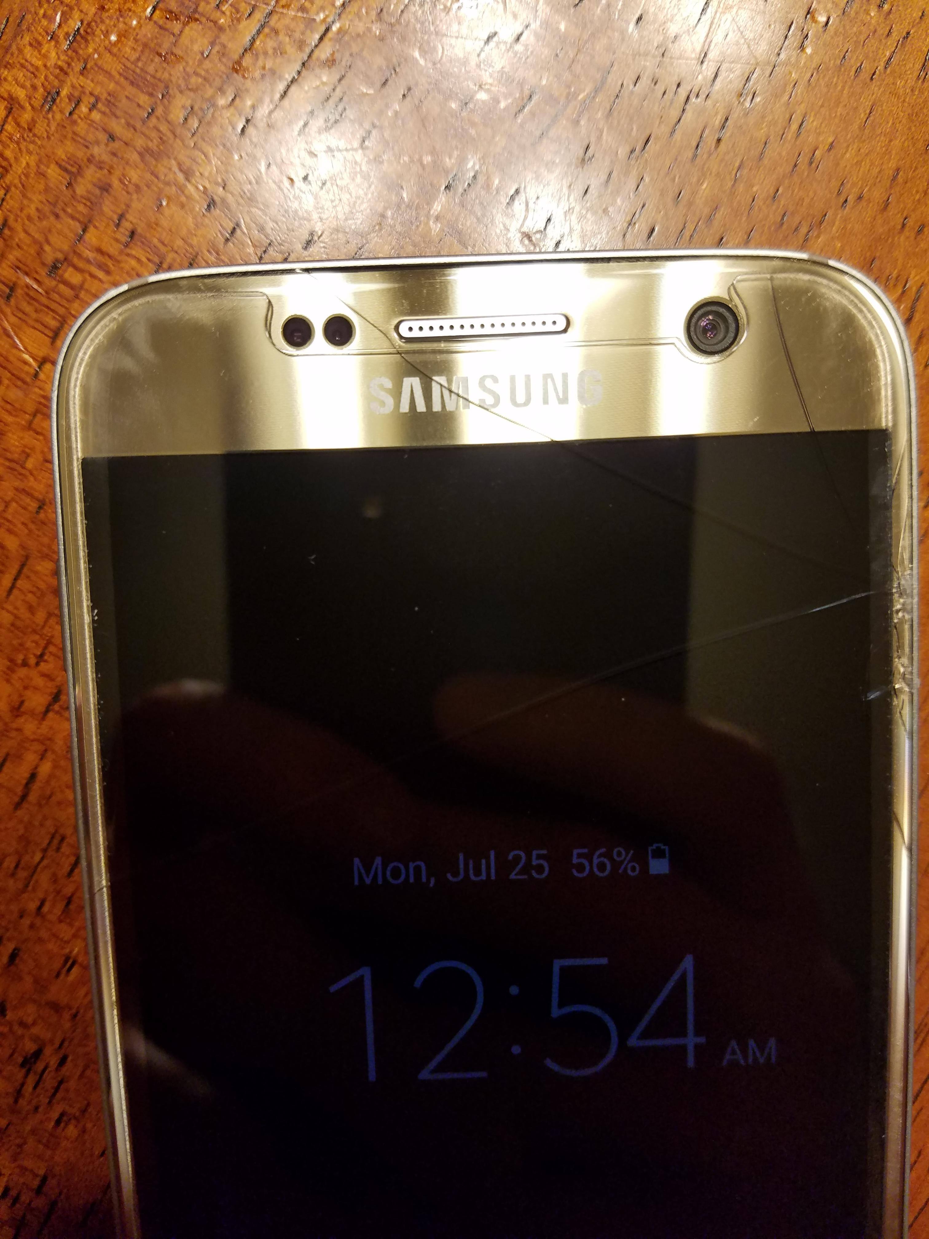 Screen behind is cracked., click to load a larger version