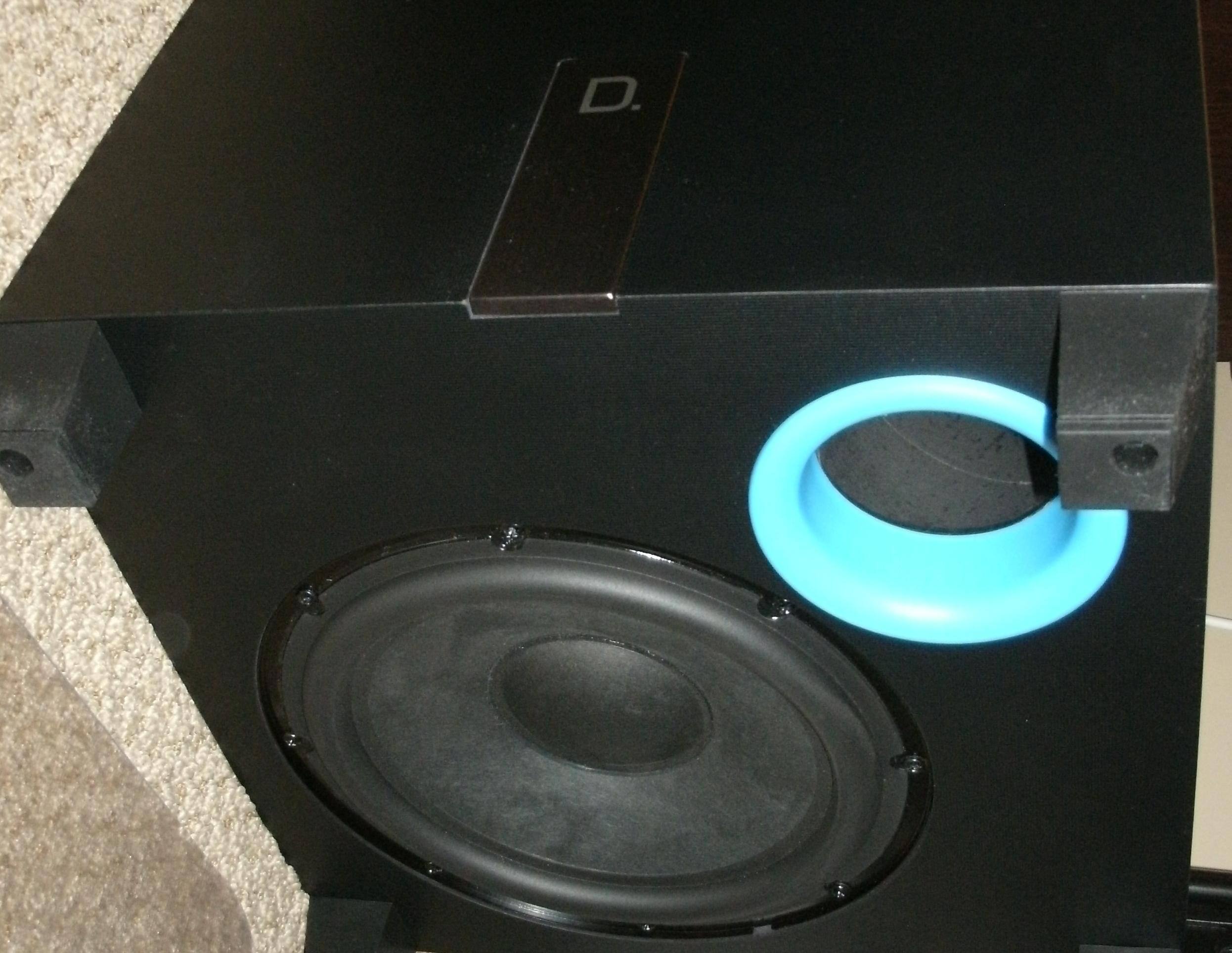 A downward-firing subwoofer is not unusual, but a downward-firing port (seen here in blue) is. Don’t use this with neighbors below!, click to load a larger version
