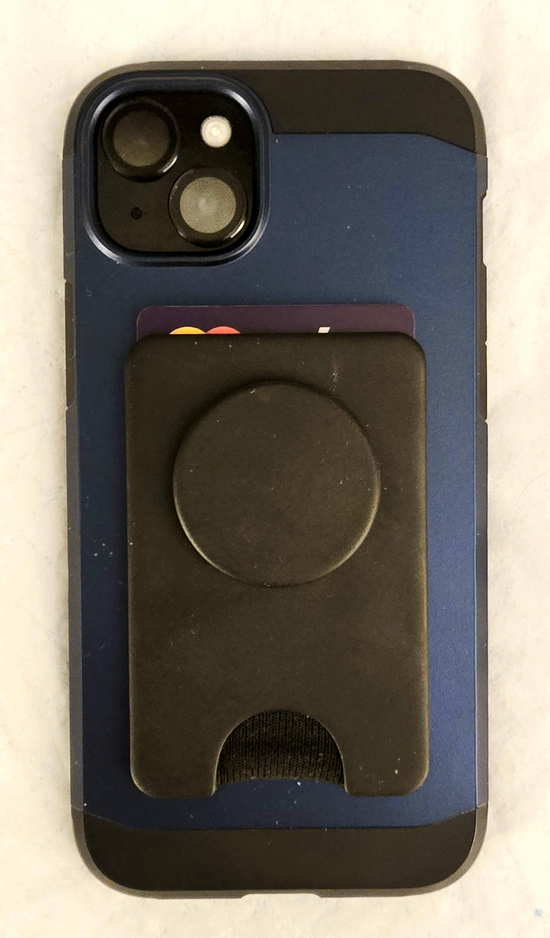 The PopSocket PopWallet fits securely on any magnetic phone back (or compatible magnetic case) and gives you a way to grip the phone with your fingers, and with this model, gives you space to carry 2-3 cards with you., click to load a larger version