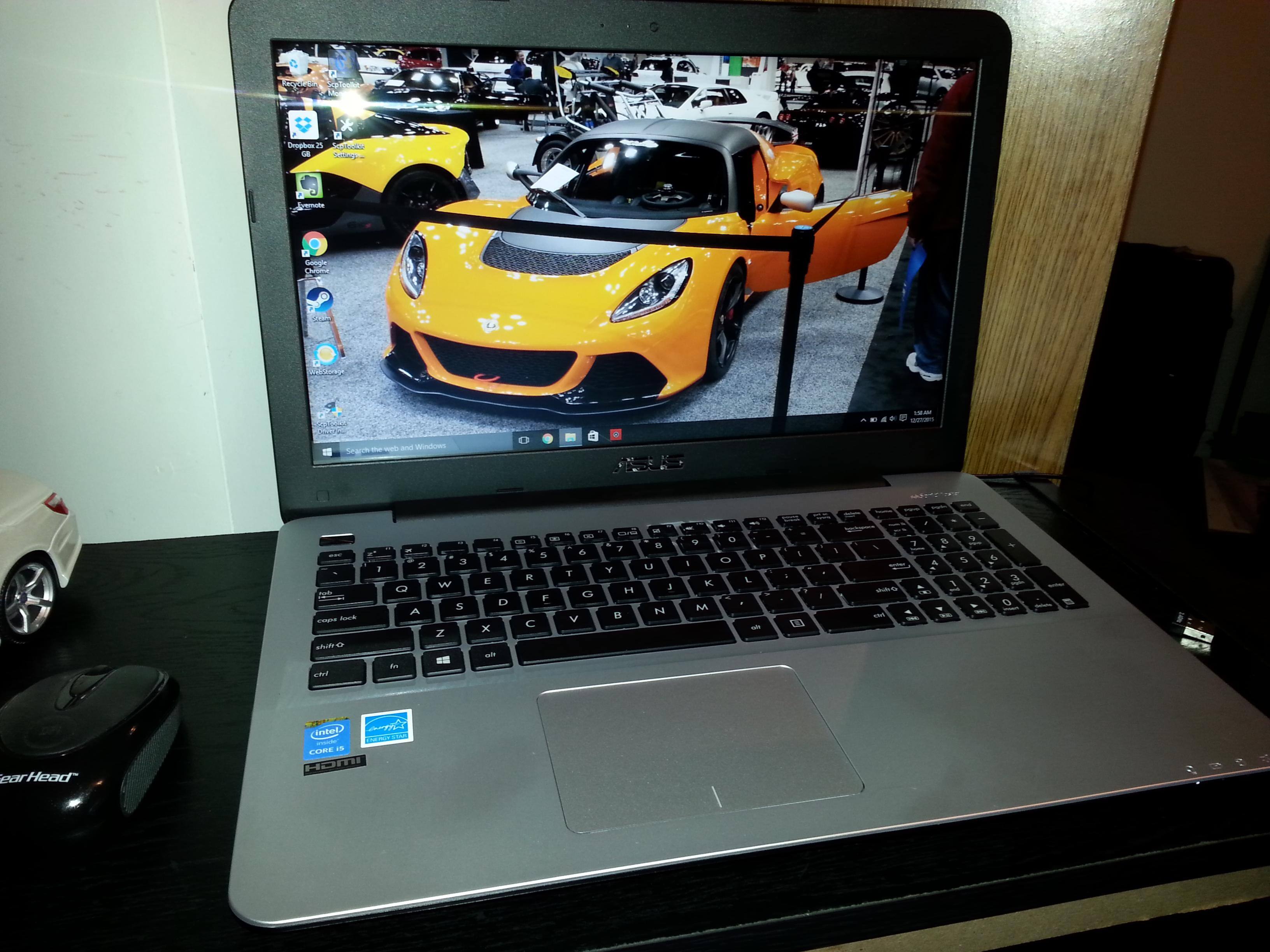 Photo taken the day I bought the laptop. Photo of laptop with photo as the desktop background also taken the day I bought the computer., click to load a larger version