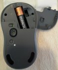 Bottom of mouse with battery showing computer selection button, click to load a larger version