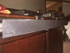 Soundbar mounted on entertainment center, click to load a larger version