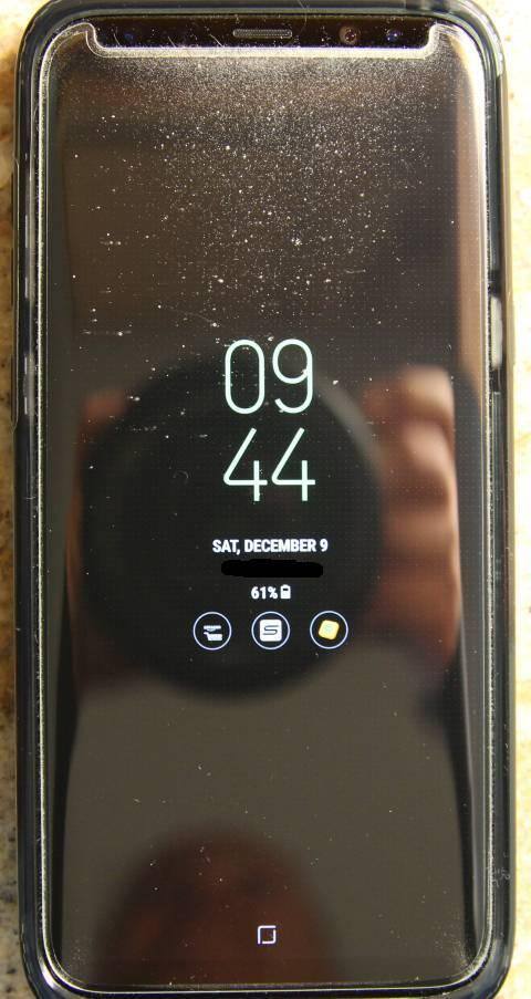 Fuzz between the protector and screen., click to load a larger version